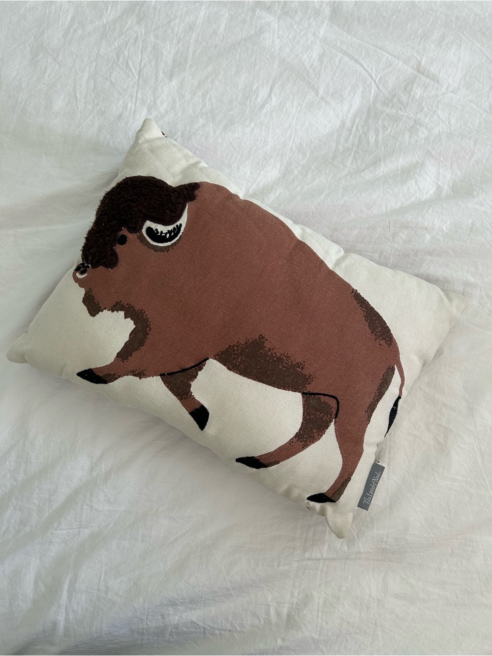 The Land of Nod Brown Buffalo Accent Pillow on Cream